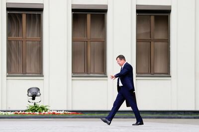 Andrei Ravkov, the head of State Secretary of the Security Council of Belarus walks after speaking to the media in Minsk, Belarus, Thursday, July 30, 2020. Belarusian authorities opened a criminal case on the charges of plotting a terrorist act against 33 Russian private military contractors detained earlier this week, Security Council secretary Andrei Ravkov said Thursday. The Russian contractors were detained on Wednesday by the Belarusian State Security Committee and accused of planning to destabilize Belarus ahead of the presidential election. (AP Photo/Sergei Grits)