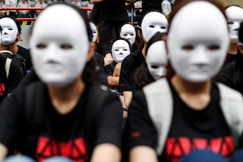Protesters sit on the ground during a protest held to bring attention to former comfort women in Taiwan, in front of Japan's Interchange Association office in Taipei, Taiwan. Ritchie B. Tongo/EPA