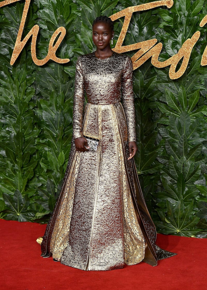 LONDON, ENGLAND - DECEMBER 10:  Adut Akech arrives at The Fashion Awards 2018 In Partnership With Swarovski at Royal Albert Hall on December 10, 2018 in London, England.  (Photo by Jeff Spicer/BFC/Getty Images for BFC)