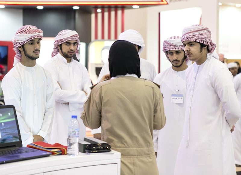 Students at the Armed Forces stall at the National Career Exhibition at Sharjah Expo Centre. Reem Mohammed / The National