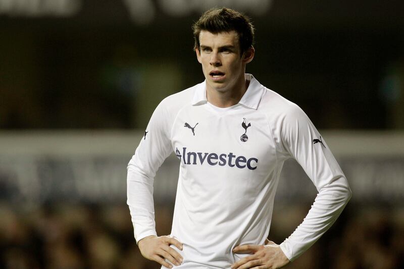 FILE - In this Wednesday, March 7, 2012 file photo, Tottenham Hotspur's Gareth Bale reacts during their English FA Cup fifth round replay soccer match against Stevenage at White Hart Lane, London. With no competitive matches in Europe, it's the intrigue over the futures of Wayne Rooney, Gareth Bale, Luis Suarez and Cesc Fabregas largely filling the void during the offseason. European clubs could be on the verge of doing hundreds of millions of dollars in transfer business before the Sept. 2 cutoff, defying both the economic climate on the continent and UEFA's relatively new Financial Fair Play rules. (AP Photo/Sang Tan, File) *** Local Caption ***  Britain Soccer FA Cup.JPEG-0a00c.jpg