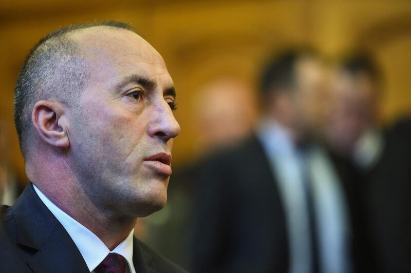 (FILES) In this file photo taken on April 27, 2017 Kosovo's former Prime Minister Ramush Haradinaj sits in the side the Court in Colmar, eastern France, on April 27, 2017, as he waits to hear the result of his extradition hearing. Ramush Haradinaj, who resigned as Kosovo's prime minister after being summoned to The Hague as a war crime suspect, said he would leave on July 23, 2019 for the Netherlands. "Yes! I am travelling tomorrow," Haradinaj said late on July 22 in an interview with private T7 television channel. Haradinaj announced on July 19 that he had been summoned to the war crimes tribunal "as a suspect" and expected to be questioned.  / AFP / SEBASTIEN BOZON
