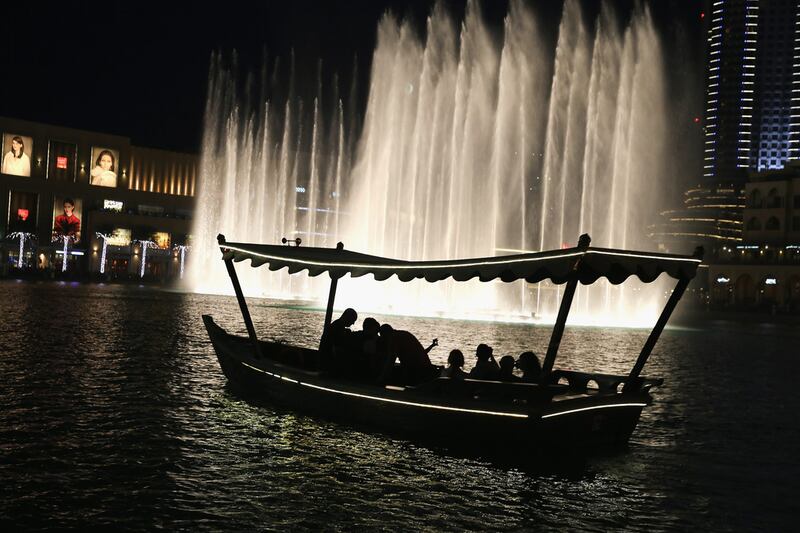 The water show at the Dubai Fountain. The reopening of international borders and the tourism sector recovery in the UAE will benefit retail landlords such as Emaar Malls Management. Getty Images