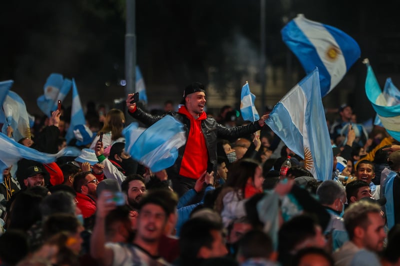 Argentina fans celebrate the Copa America champions' title of the national soccer team at the Obelisco national monument in Buenos Aires, Argentina, 10 July 2021.  Argentina beat Brazil 1-0 in the final to win Copa America, its first major title in 28 years.   EPA / JUAN IGNACIO RONCORONI