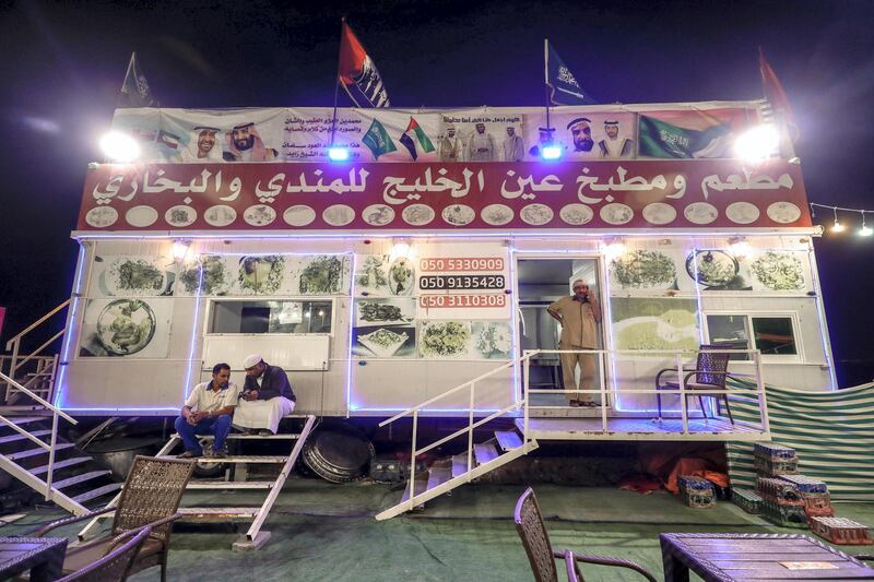 Abu Dhabi, United Arab Emirates, December 10, 2019.  
  -- Mohammed Abdulla, centre, opened a branch of his Yemeni restaurant at the Al Dhafra Festival in 2016.
Victor Besa/The National
Section:  NA
Reporter:  Anna Zacharias