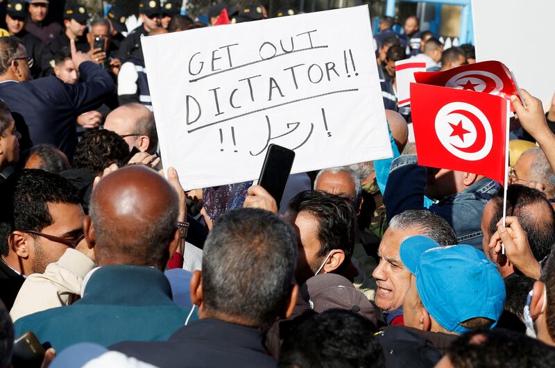 Demonstrators with flags and placards at the protest. Reuters