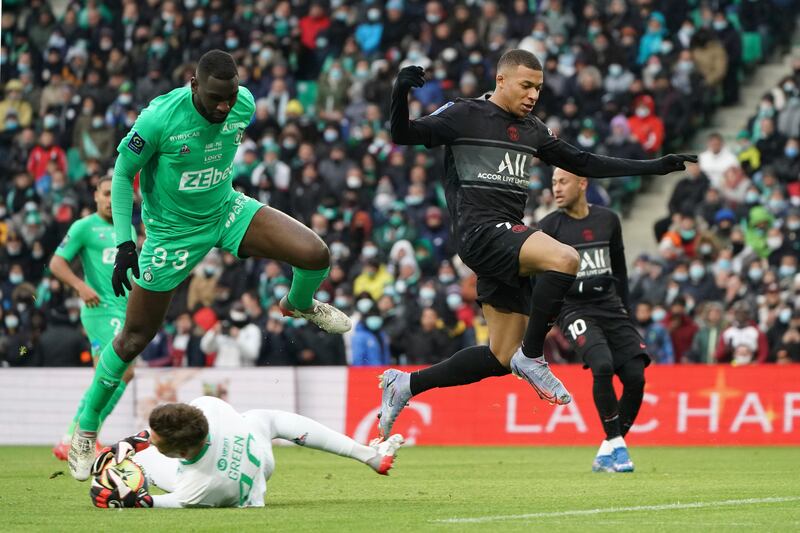 Saint-Etienne goalkeeper Etienne Green saves from PSG's Kylian Mbappe. AP