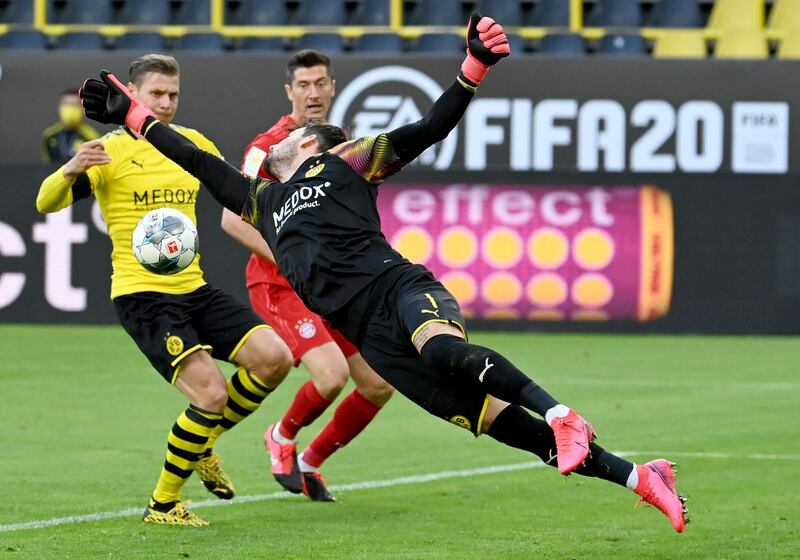 Dortmund's Swiss goalkeeper Roman Buerki makes a save. AFP