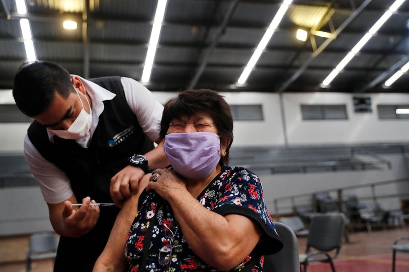 Braulia Amarilla, 75, being injected with a dose of the AstraZeneca vaccine in Asuncion, Paraguay. AP Photo