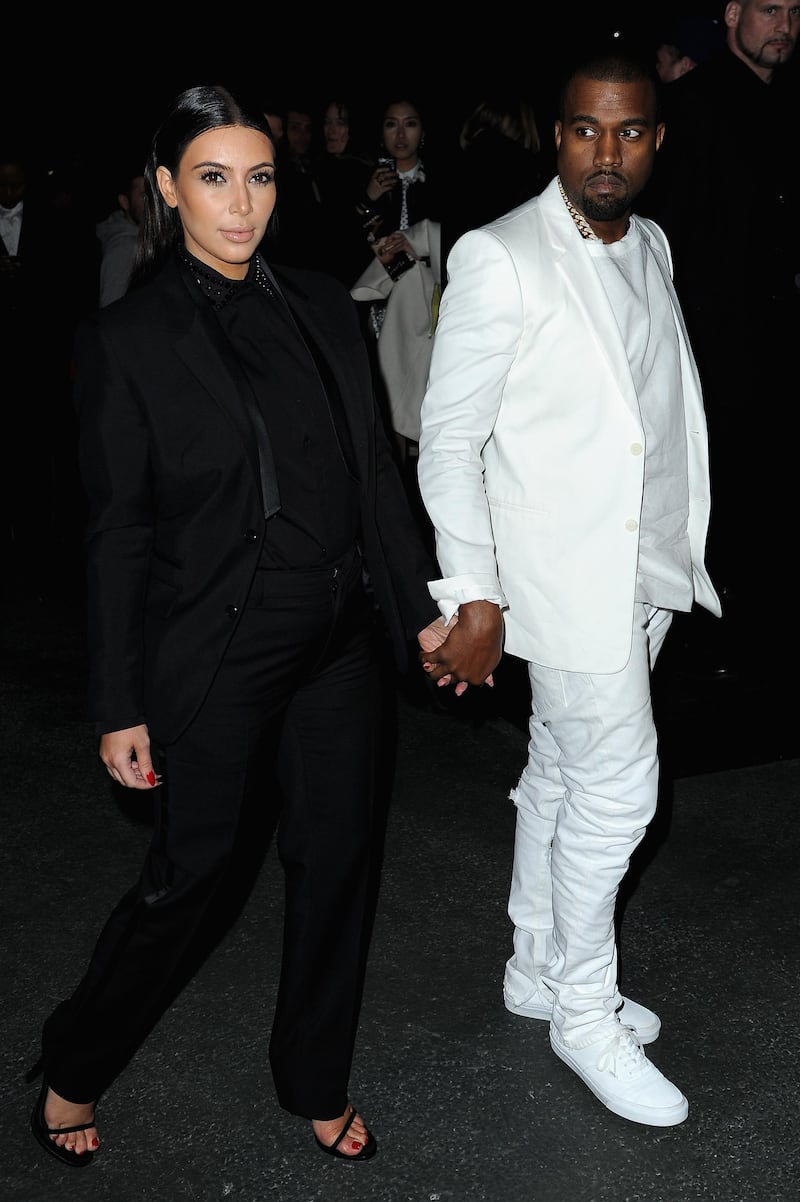 PARIS, FRANCE - MARCH 03:  Kim Kardashian and Kanye West attend Givenchy  Fall/Winter 2013 Ready-to-Wear show as part of Paris Fashion Week on March 3, 2013 in Paris, France.  (Photo by Pascal Le Segretain/Getty Images)