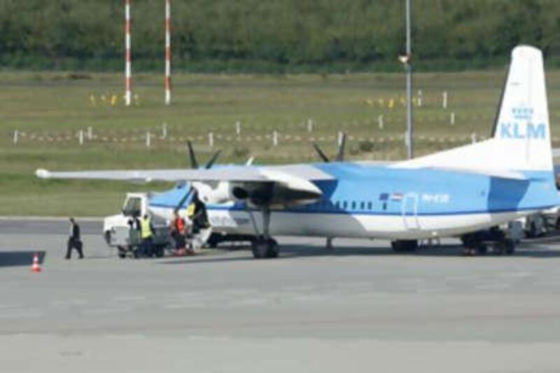Passengers leave a KLM aircraft at the Cologne airport on Sept 26 2008. German police boarded a Dutch airliner at Cologne airport and arrested two men suspected of planning to take part in attacks, a spokesman said.