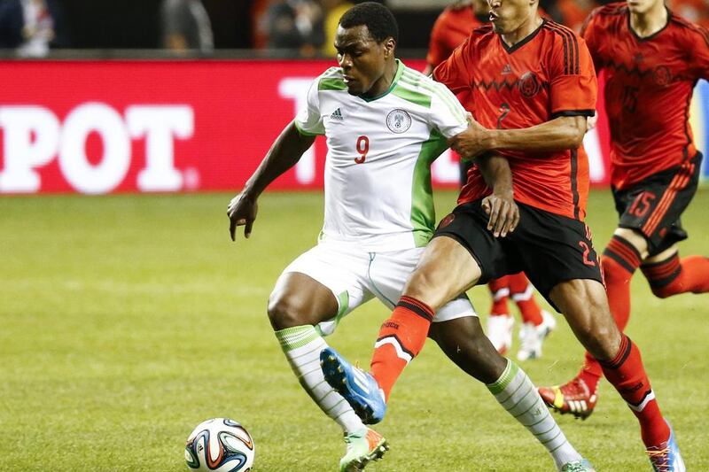 Emanuel Emenike and Nigeria drew Mexico 0-0. They'll play in Group F at the 2014 World Cup with Argentina, Bosnia Herzegovina and Iran. Erik S Lesser / EPA