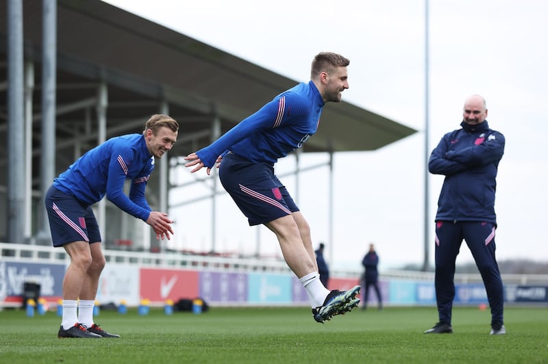 BURTON UPON TRENT, ENGLAND - MARCH 23: Luke Shaw and James Ward-Prowse of England in action during a training session ahead of an upcoming FIFA World Cup Qatar 2022 Euro Qualifier against San Marino at St George's Park on March 23, 2021 in Burton upon Trent, England. (Photo by Eddie Keogh - The FA/The FA via Getty Images)