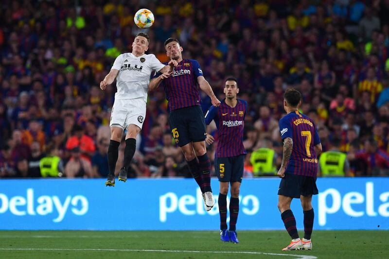 Valencia's Kevin Gameiro competes for the ball with Clement Lenglet. Getty