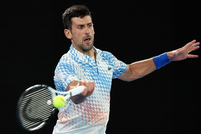Serbia's Novak Djokovic hits a return against Australia's Alex de Minaur. AFP