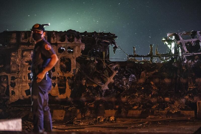 The wreckage of Lion Air Flight RPC 5880 is seen at the runway of Ninoy Aquino International Airport after it crashed in Manila. Getty Images