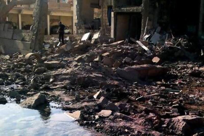 A Syrian man stands in rubble at the scene of a car bomb attack in Qamishli, 800 kilometres northeast of Damascus. The bombing is the latest sign that Syria’s largest ethnic minority is increasingly being drawn into the widening civil war.