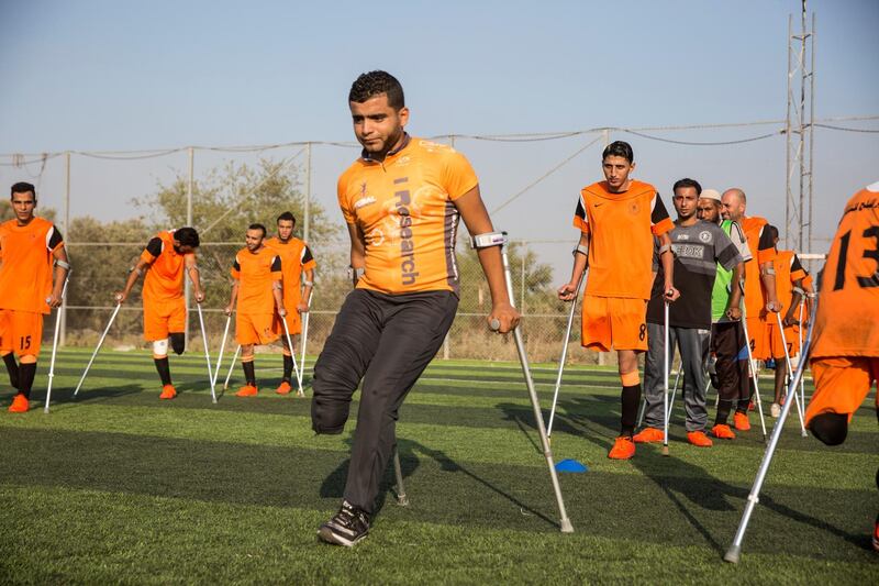 Ball Safi, a new player who just joined , as he is about to bounce the football off his head during a practice session  of Gaza's first amputee football team during a practice session held at the municipal ball field of Deir Al Balah ,Gaza on July 16,2018. Bilal lost his leg in an accident .
The team meets weekly and believes they can help spread hope to others with similar injuries to over come their disability .The team dreams to compete internationally .(Photo by Heidi Levine for The National).