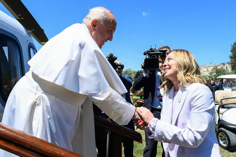 Ms Meloni welcomes Pope Francis. EPA 