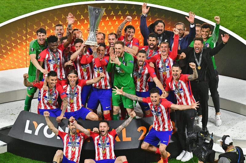 Atletico Madrid players celebrate with the trophy after winning the UEFA Europa League final between Olympique Marseille and Atletico Madrid in Lyon, France, on May 16, 2018. Atletico won 3-0. Sascha Steinbach / EPA