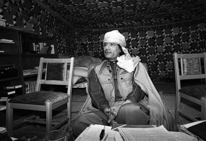 Libyan leader Muammar Gaddafi looks on during a news conference where he presented his family to U.S. female journalists inside his Bedouin tent erected in the heavily fortified Bab El-Assaria barracks on the outskirts of Tripoli in this January 12, 1986 file photo. Deposed Libyan leader Gaddafi was captured and wounded near his hometown of Sirte at dawn on October 20, 2011 as he tried to flee in a convoy which NATO warplanes attacked, National Transitional Council official Abdel Majid said on Thursday. REUTERS/Kate Dourian/Files (LIBYA - Tags: POLITICS CIVIL UNREST) QUALITY FROM SOURCE *** Local Caption ***  SIN28_LIBYA-_1020_11.JPG