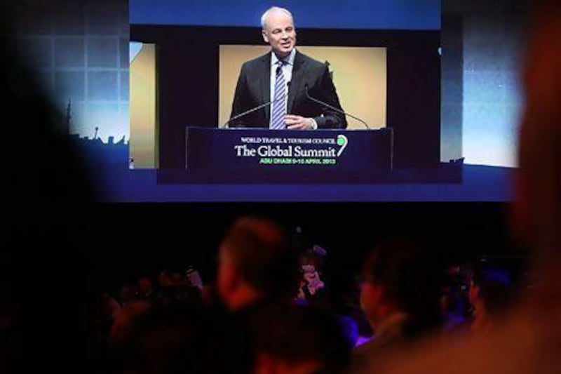 David Scowsill, the chief executive of the WTTC, gives the opening address at the council's global summit in Abu Dhabi yesterday. Delores Johnson / The National
