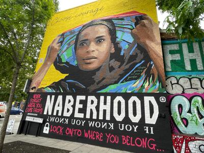 Ramla Ali’s face looms larger than life out of a community tribute three storeys tall in Bethnal Green. Jacqueline Fuller / The National