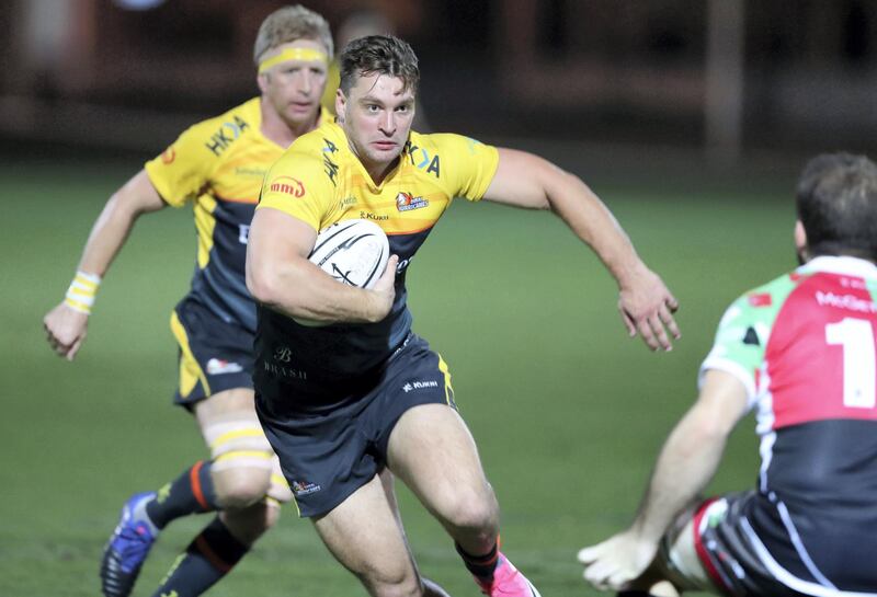 Abu Dhabi, United Arab Emirates - October 12, 2018: Hurricanes' Stuart Jordan is tackled in the game between Abu Dhabi Harlequins and Dubai Hurricanes in the West Asia Premiership. Friday, October 12th, 2018 at Zayed Sports City, Abu Dhabi. Chris Whiteoak / The National