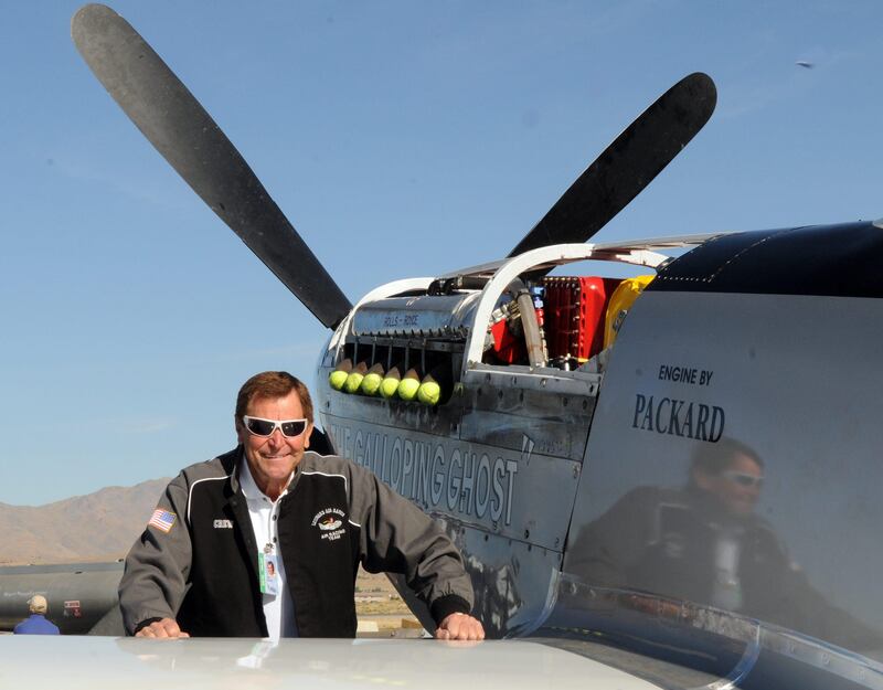 This Wednesday, Sept. 15, 2010 photo, shows long time Reno Air Race pilot Jimmy Leeward with his P51 Mustang.  A spokesman for Reno's National Championship Air Races says the P-51 Mustang that crashed into a box seat area at the front of the grandstand Friday, Sept. 16, 2011, at the air race was piloted by Leeward. An official reported Friday that Leeward was killed in the crash. (AP Photo/The Reno Gazette-Journal, Marilyn Newton) *** Local Caption ***  Air Show Crash.JPEG-02ada.jpg