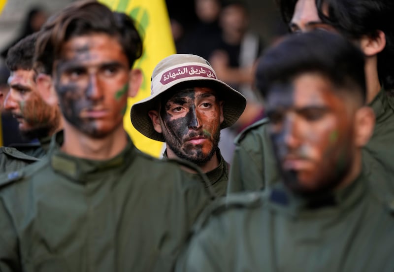 Hezbollah fighters at the funeral of their two comrades in Kherbet Selem. AP Photo 