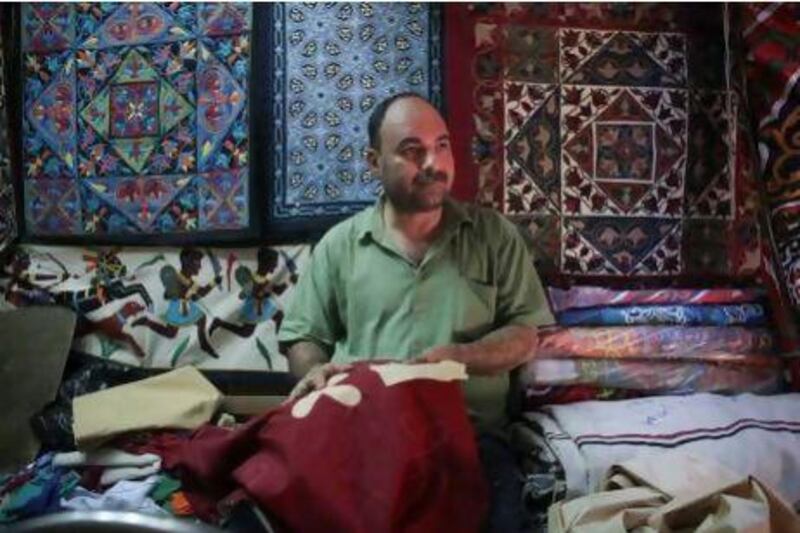 Vendors such as Tarek Fattouh, who sells tapestries, face an uphill struggle . Tara Todras-Whitehill