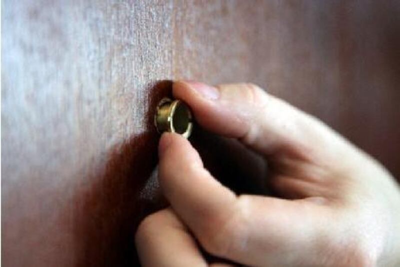 A step by step of how to install a peep hole in a door.
