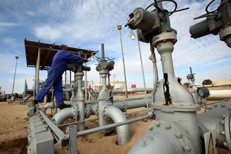 A worker checks pipes and valves at Amaal oil field in Libya. Oil prices have picked up the pace, rising more than 10% last week amid expectations of reduced production in the US ahead of a storm and due to declining Covid-19 infections in China, the biggest importer of crude. Reuters