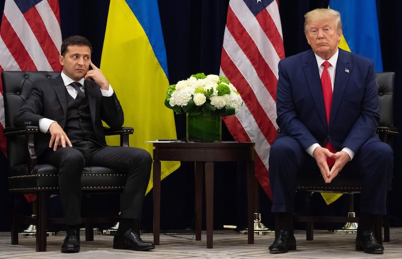 (FILES) In this file photo taken on September 25, 2019 US President Donald Trump and Ukrainian President Volodymyr Zelensky look on during a meeting in New York on the sidelines of the United Nations General Assembly. A US budget official told the Pentagon to "hold off" on military aid to Kiev 90 minutes after a controversial phone call between President Donald Trump and his Ukrainian counterpart Volodymyr Zelensky, according to an internal email. / AFP / SAUL LOEB
