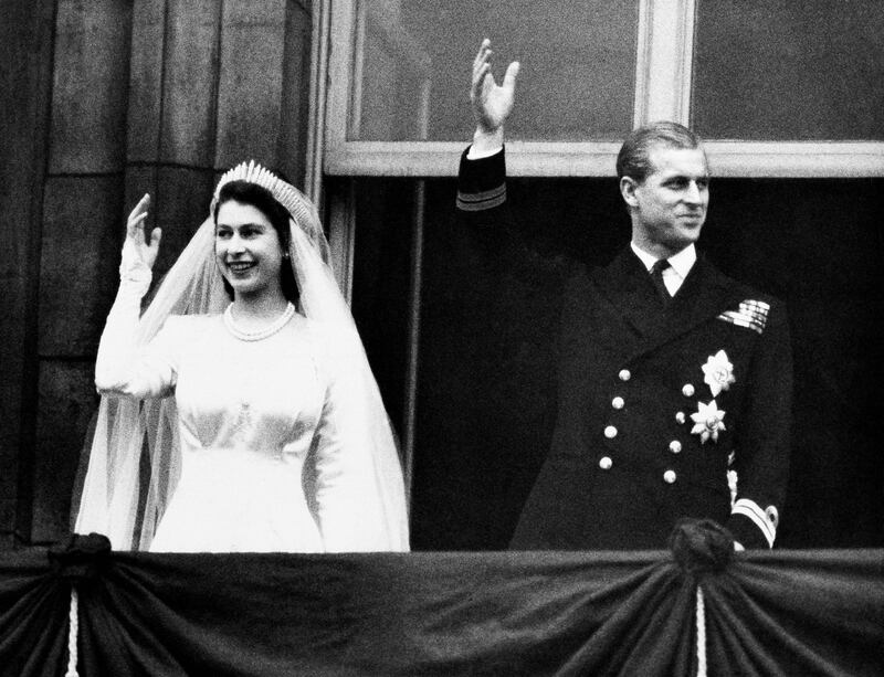 Britain's Princess Elizabeth and Prince Philip wave to the crowds on their wedding day, from the balcony of Buckingham Palace in London. AP Photo