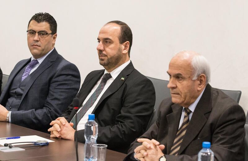 epa06388860 Nasr al-Hariri (C), Head of the Syrian Negotiation Commission (SNC), attends a round of negotiation with UN Special Envoy of the Secretary-General for Syria Staffan de Mistura (not pictured), during the Intra Syria talks, at the European headquarters of the United Nations in Geneva, Switzerland, 14 December 2017.  EPA/XU JINQUAN / POOL