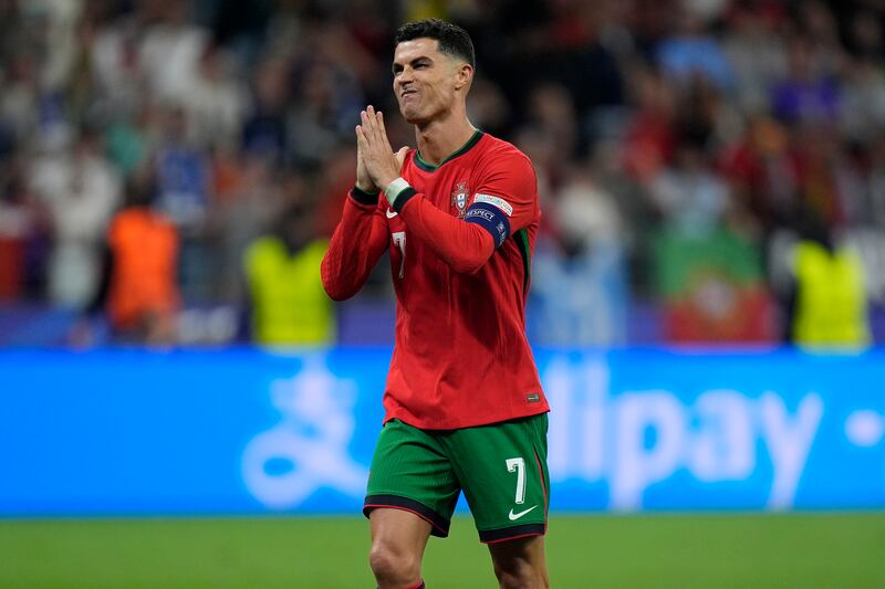 Portugal's Cristiano Ronaldo reacts after scoring in the penalty shoot-out. AP 