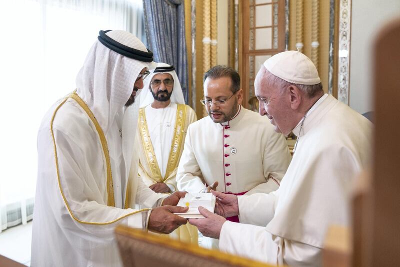 ABU DHABI, UNITED ARAB EMIRATES - February 4, 2019: Day two of the UAE papal visit - His Holiness Pope Francis, Head of the Catholic Church (R), presents a gift to HH Sheikh Mohamed bin Zayed Al Nahyan, Crown Prince of Abu Dhabi and Deputy Supreme Commander of the UAE Armed Forces (L), during an official reception at the Presidential Palace. 
( Ryan Carter / Ministry of Presidential Affairs )
---