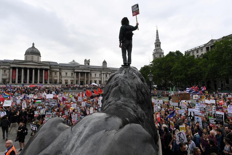 Demonstrators take part in a protest against Donald Trump in Trafalgar Square, London. Reuters