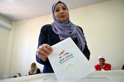 A Lebanese government employee casts her ballot for the parliamentary elections at a polling station in Beirut. EPA