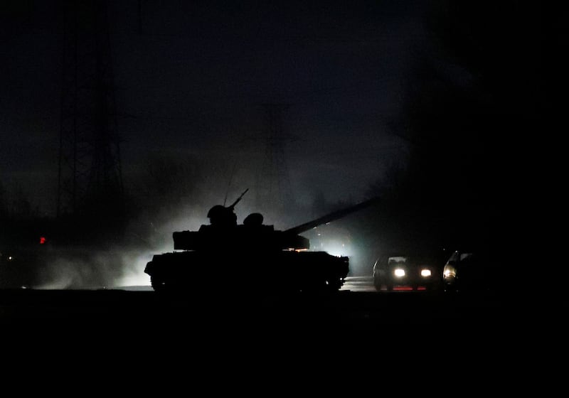 A tank drives along a street in the city of Donetsk. Reuters