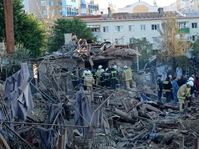 Rescue specialists work at the site of a destroyed residential building after blasts in Belgorod, Russia. Reuters