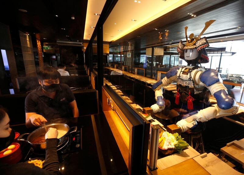 A robot serves customers at a Japanese robot restaurant in Bangkok, Thailand. Thailand's first Japanese robot restaurant, Hajime, where the serving waiters are robots, has been operating since 2010, serving Japanese food shabu, yakiniku and sushi. EPA