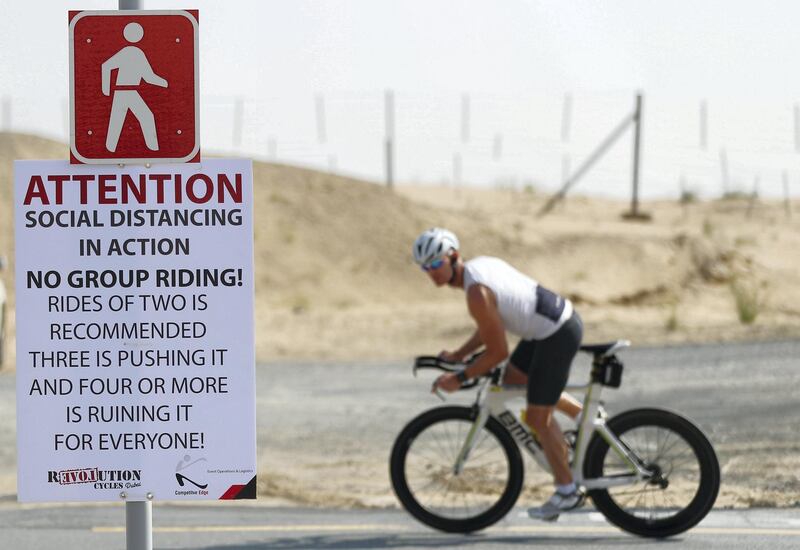 Dubai, United Arab Emirates - Reporter: N/A: A sign at Al Qudra cycle path warns people about cycling in groups in light of the corona virus. Wednesday, March 25th, 2020. Dubai. Chris Whiteoak / The National