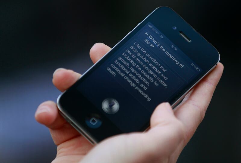 A 2011 demonstration of Siri, an application that uses voice recognition and detection on the iPhone 4S. Reuters