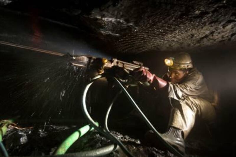 Mineworkers drill at the rock face at the Impala Platinum mine in Rustenburg, South Africa, on Wednesday, June 4, 2008. Impala Platinum Holdings Ltd is the world's second-biggest platinum producer. Photographer: Nadine Hutton/Bloomberg News