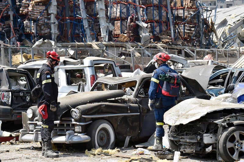 Greek rescue workers search amid the rubble three days after explosions that hit Beirut port.  EPA