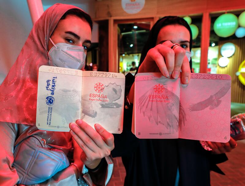 Expo 2020 Dubai visitors from Saudi Arabia get their passports stamped at the Spain pavilion. Victor Besa / The Nationa