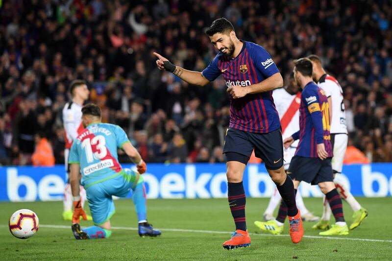 Barcelona's Luis Suarez celebrates after scoring his team's third goal. Getty Images