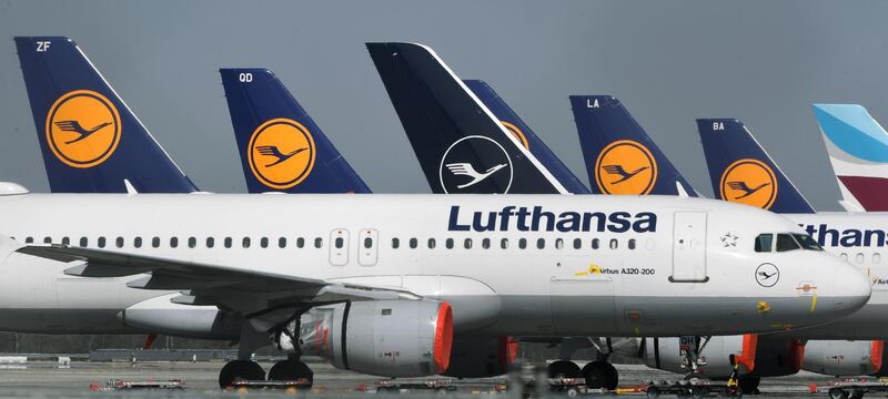 (FILES) In this file photo taken on March 27, 2020, planes of German airline Lufthansa are parked at the "Franz-Josef-Strauss" airport in Munich, southern Germany, amid the novel coronavirus COVID-19 pandemic. Europe's biggest airline group Lufthansa said on may 3, 2020 it was close to a deal with the German government on state aid to ease the impact of the coronavirus crisis. / AFP / Christof STACHE
